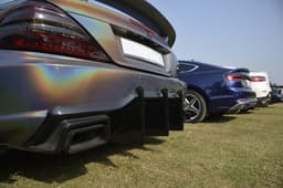 Diffusing the situation. An Audi S5 is flanked by two Mercs.  